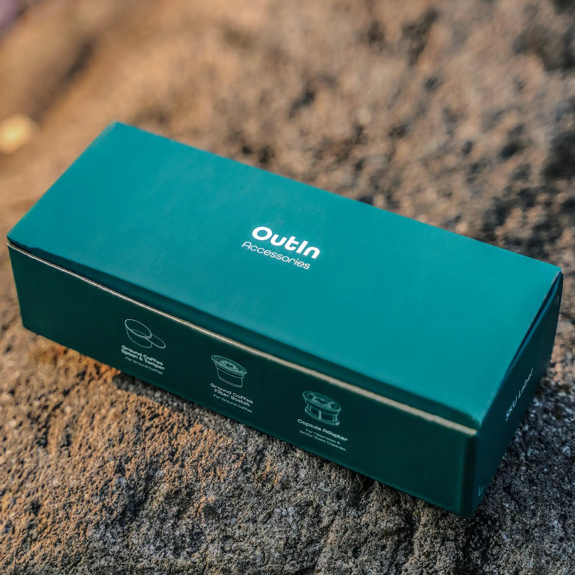 Outin accessories kit box highlighting espresso brewing tools