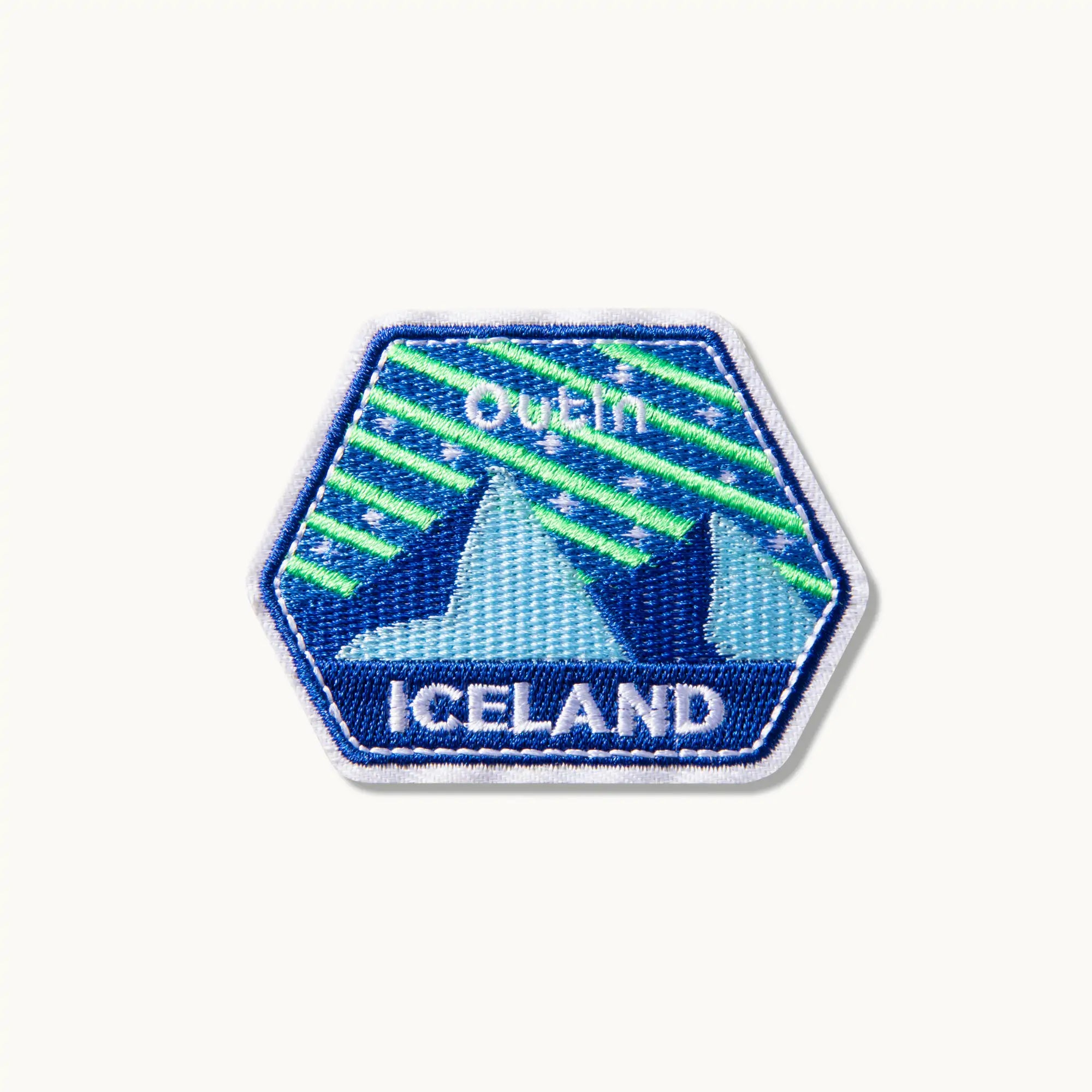 Outin Iceland patch with mountain and aurora borealis design