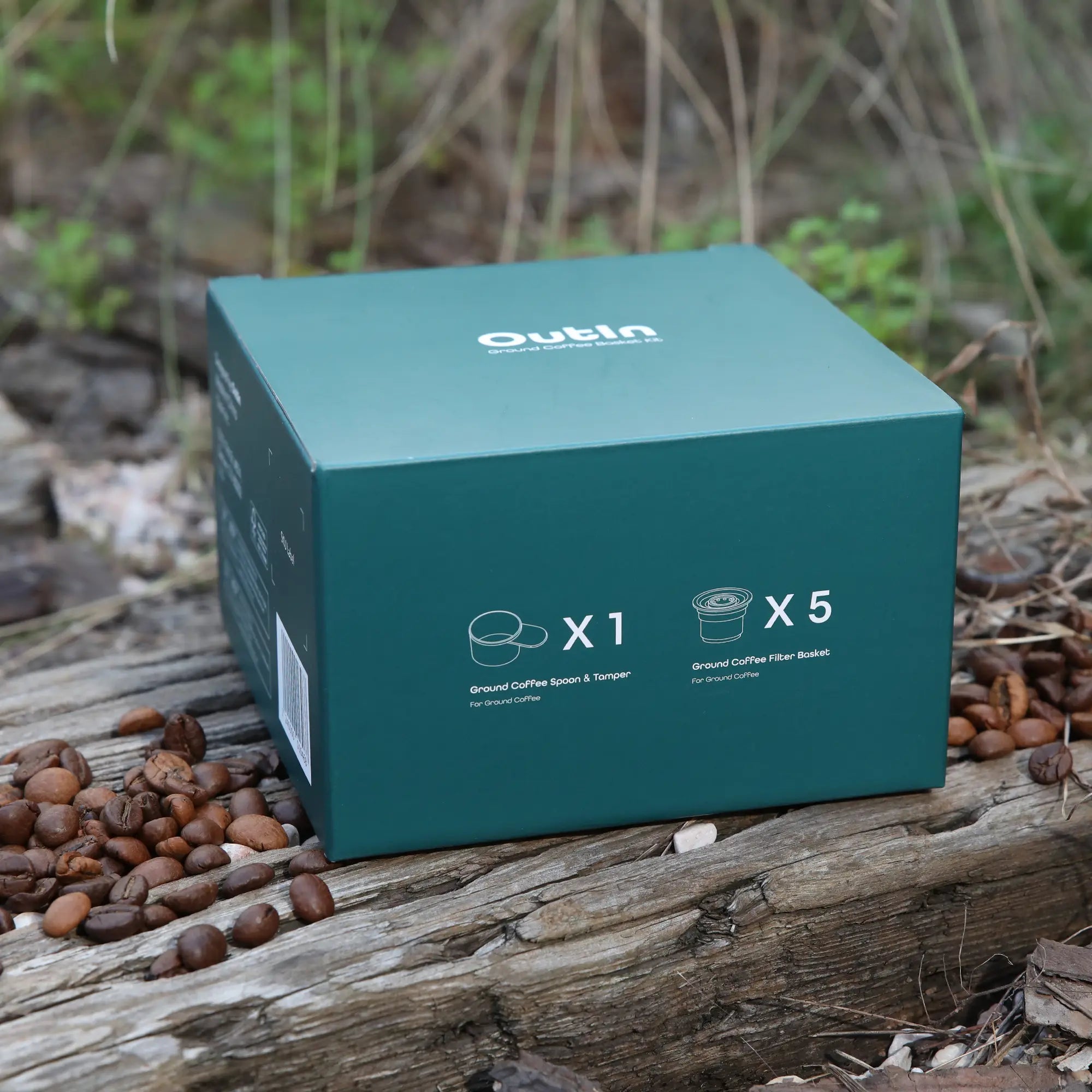 The Nano Portable Espresso Machine Filter Baskets Kit with Ground Coffee Filter Baskets and Ground Coffee Spoon in the teal box, which is ideal for Outin Nano.